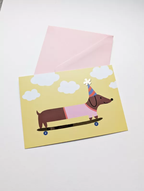 Carte postale - Teckel en skate